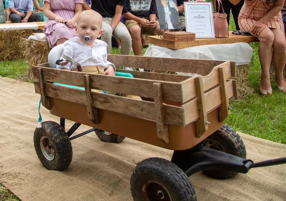 baby in wagon at old carter barn