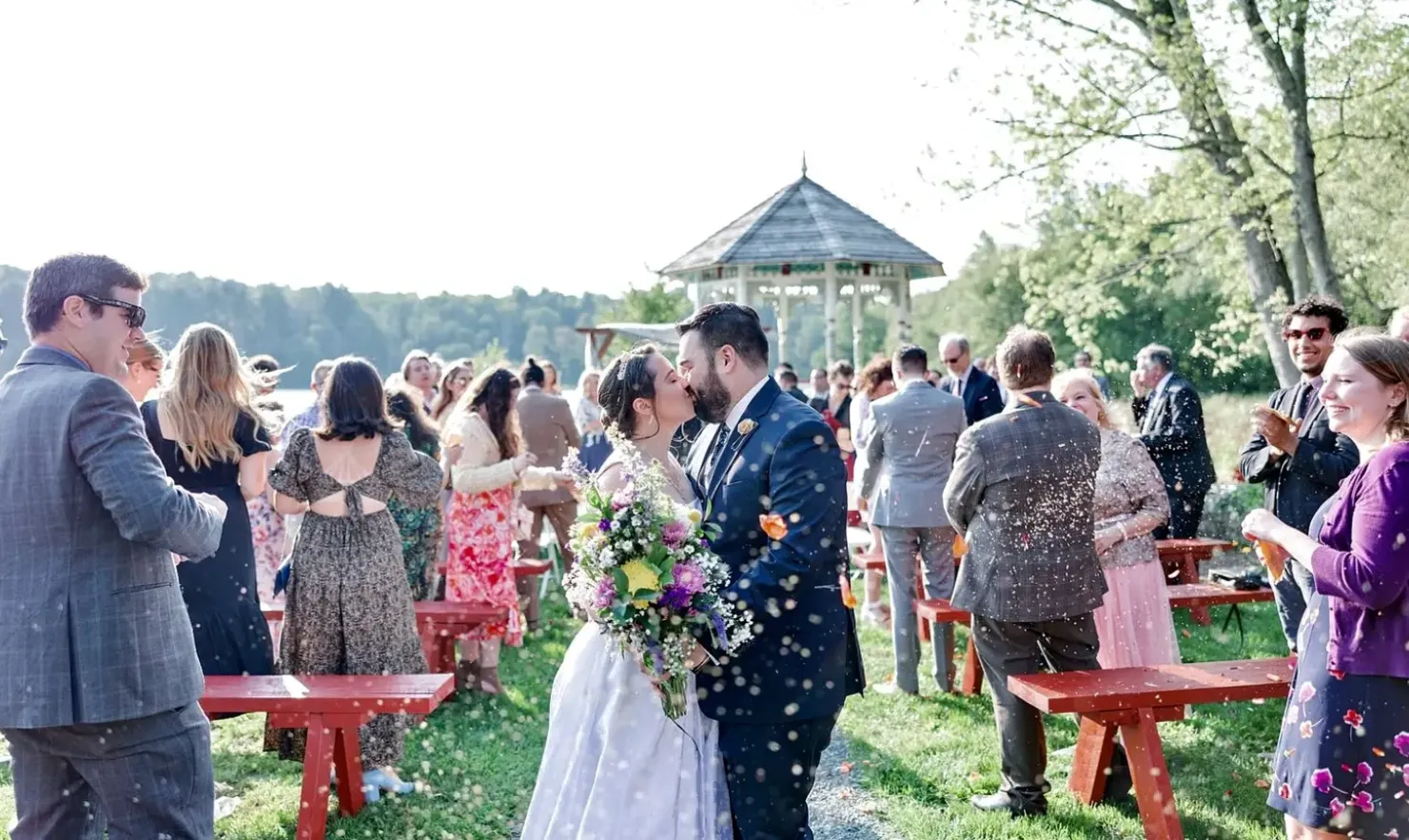 couple kissing at ceremony gazebo lake carter at old carter barn