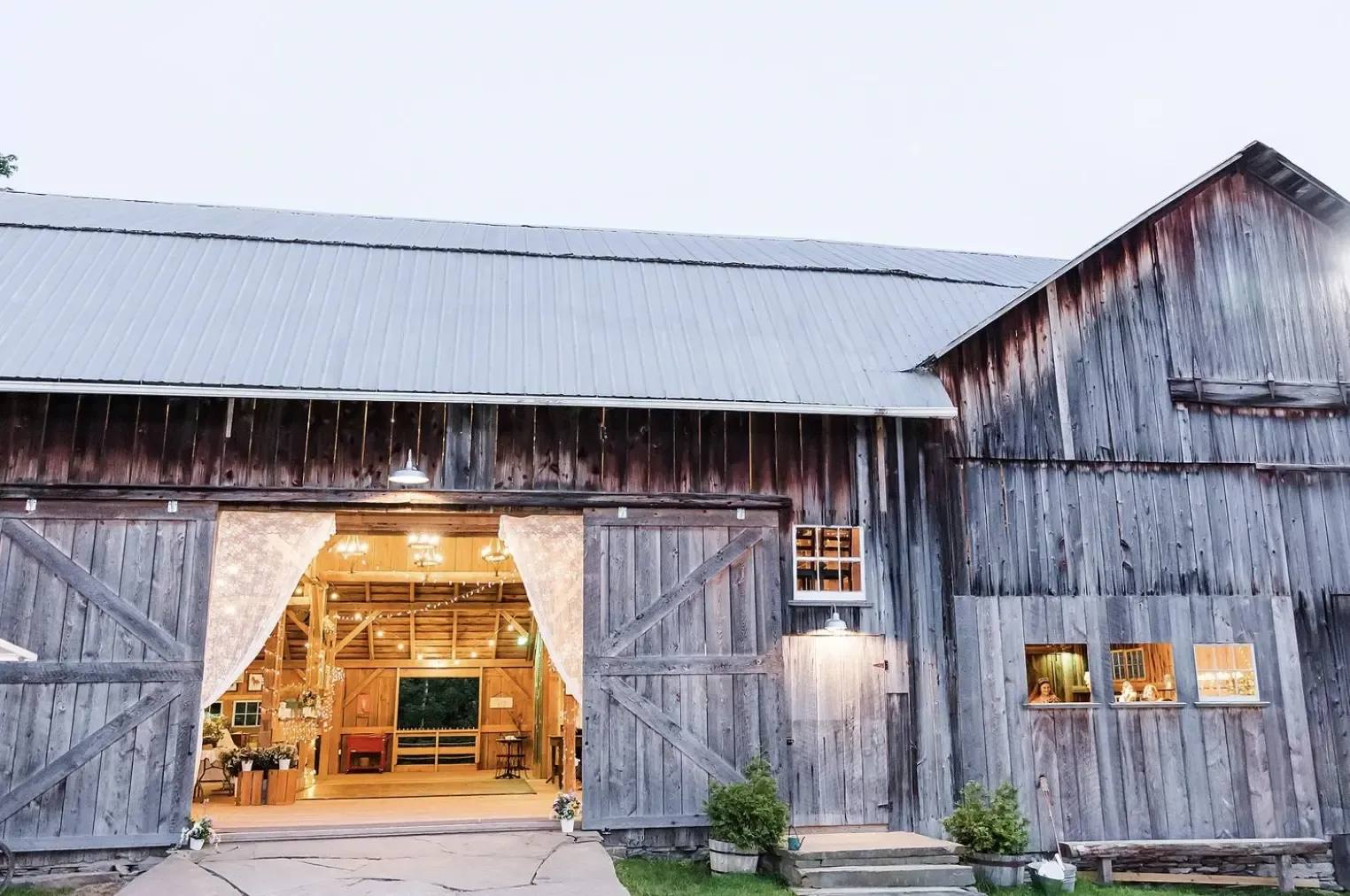 view of the barn from outside with curtains old carter barn